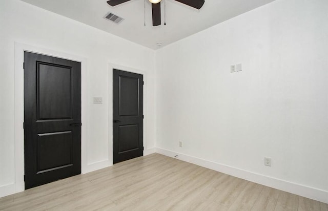 spare room with ceiling fan and light hardwood / wood-style floors