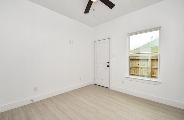 empty room featuring ceiling fan and light wood-type flooring