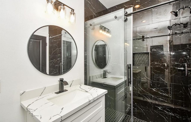 bathroom featuring walk in shower and vanity