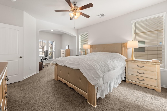 carpeted bedroom featuring ceiling fan