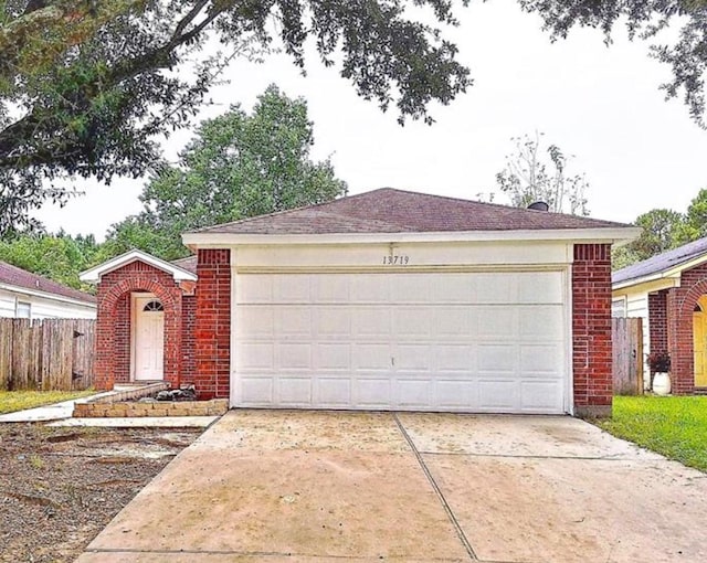 ranch-style home with a garage