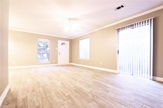 empty room with ceiling fan, ornamental molding, and light hardwood / wood-style floors