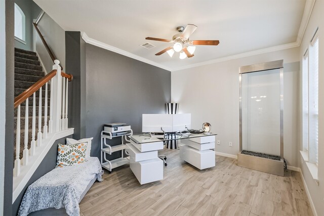 office space featuring ceiling fan, ornamental molding, and light hardwood / wood-style flooring