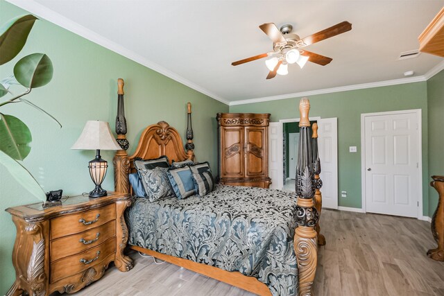 bedroom with ceiling fan, crown molding, and light hardwood / wood-style floors