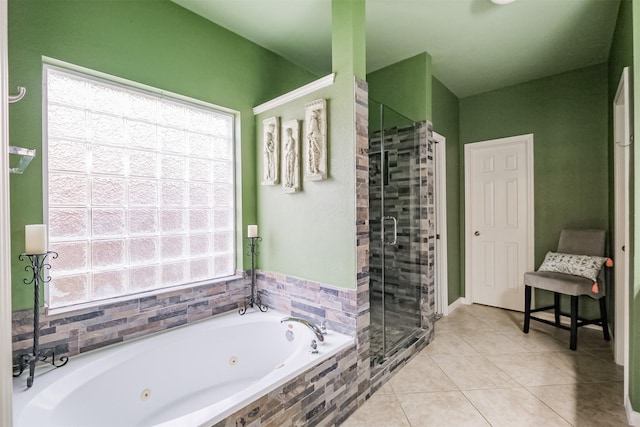 bathroom featuring a healthy amount of sunlight, tile patterned flooring, and shower with separate bathtub