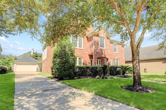 view of front of house featuring a front lawn and a garage