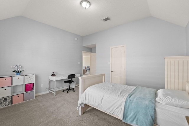 carpeted bedroom featuring lofted ceiling