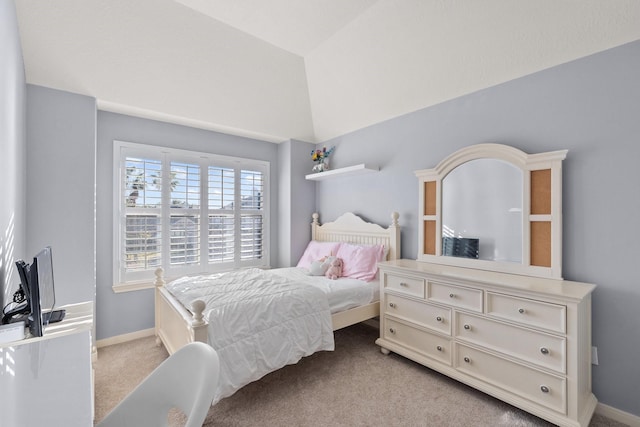 carpeted bedroom with vaulted ceiling