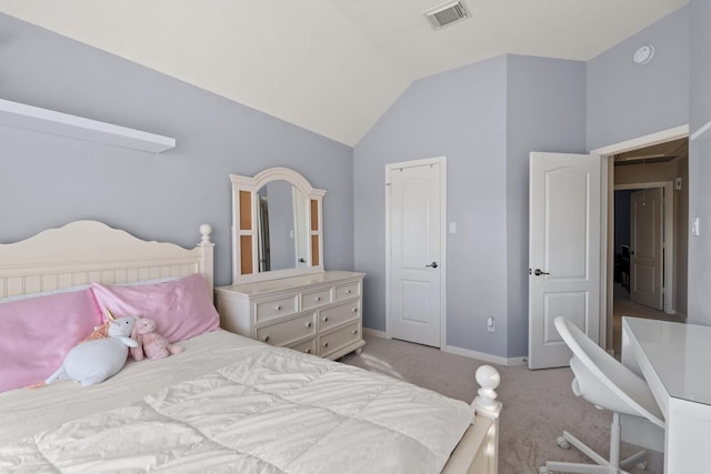 bedroom with lofted ceiling and light carpet