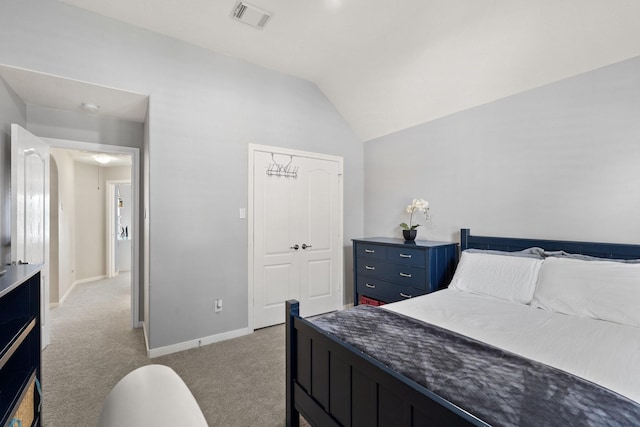 bedroom with light carpet and vaulted ceiling