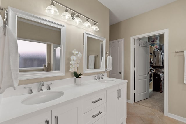 bathroom with tile patterned floors, vanity, and an enclosed shower