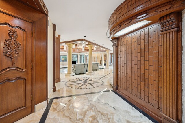 hallway featuring ornate columns