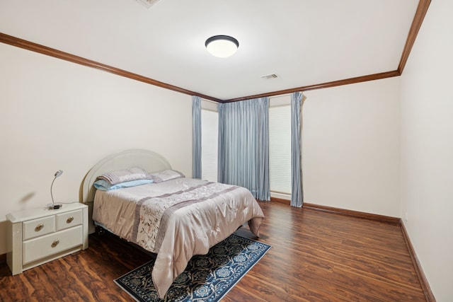 bedroom with dark wood-type flooring and crown molding