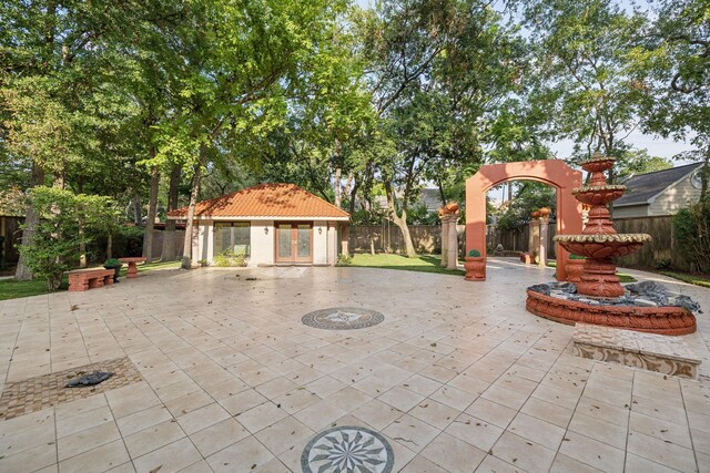 view of patio featuring an outbuilding