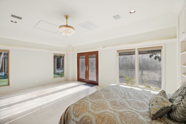 bedroom featuring multiple windows and french doors