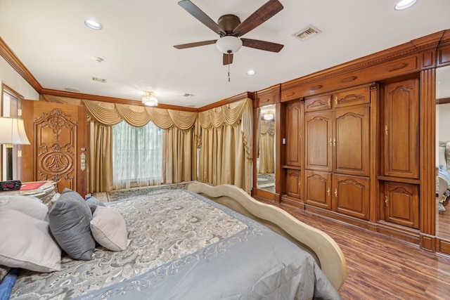 bedroom featuring dark hardwood / wood-style flooring and ornamental molding