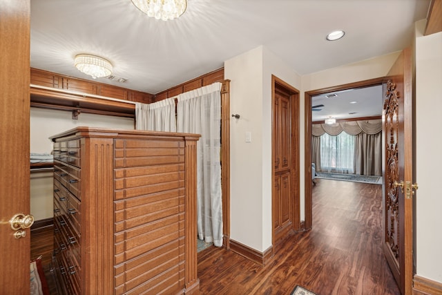 corridor with dark wood-type flooring