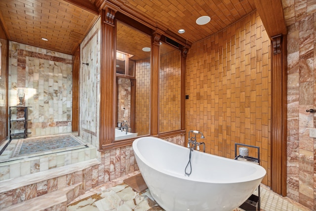 bathroom featuring a tub and brick ceiling