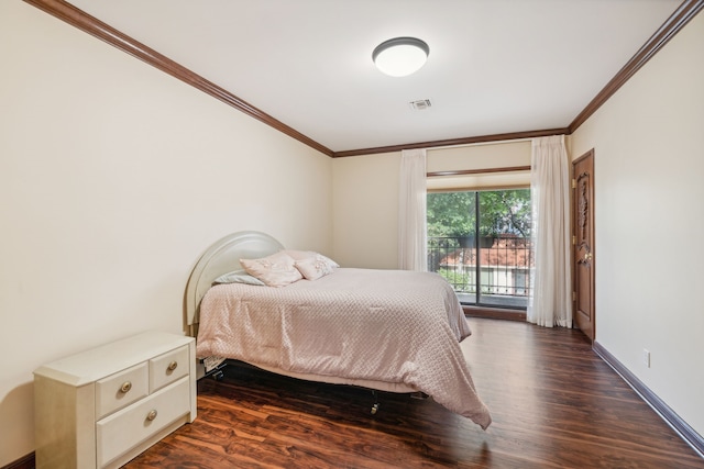 bedroom with ornamental molding, access to exterior, and dark hardwood / wood-style flooring