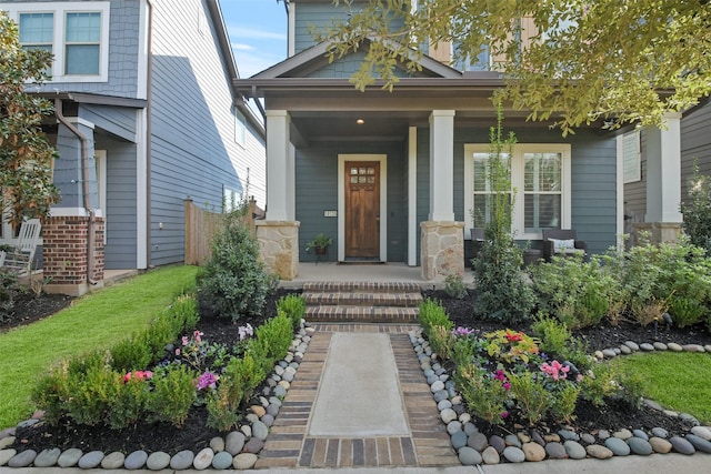 view of exterior entry with a porch