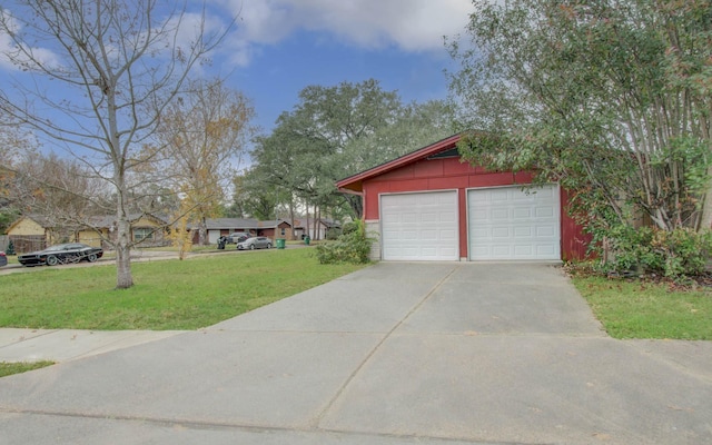 garage featuring a yard