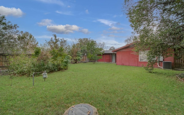 view of yard featuring central AC