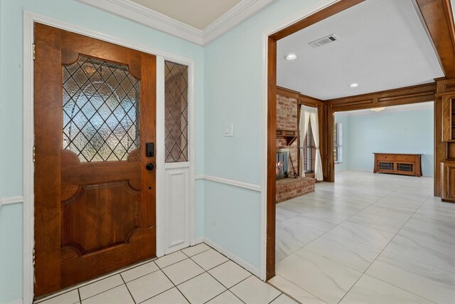 entryway featuring crown molding