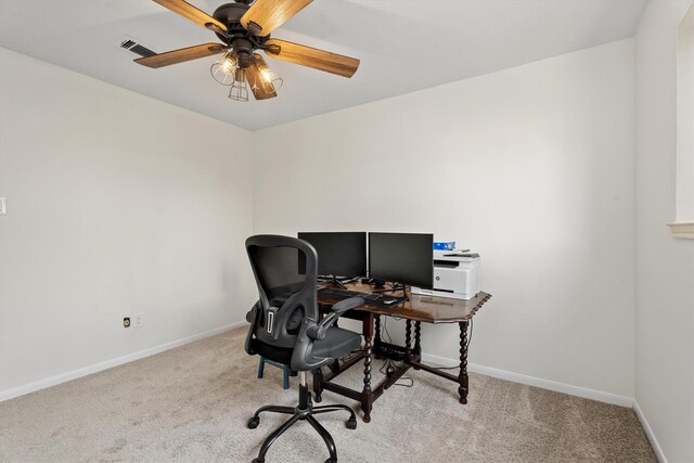 office area with ceiling fan and light colored carpet