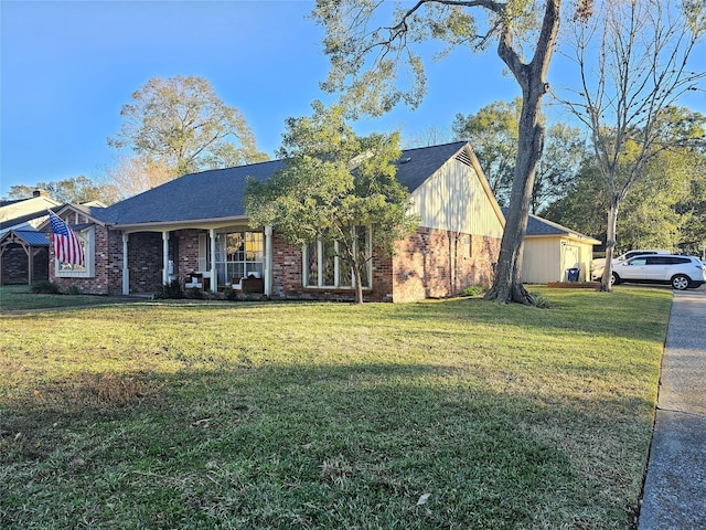 view of front of property with covered porch and a front yard