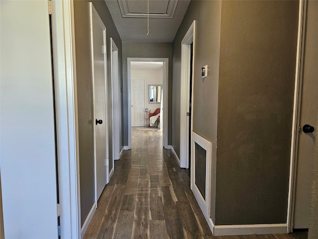 hallway featuring dark hardwood / wood-style flooring