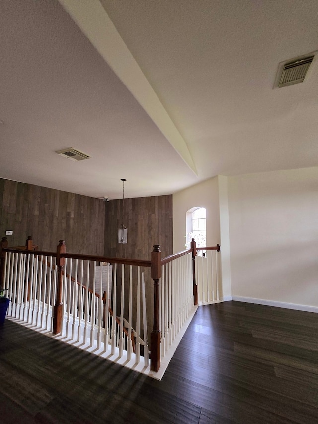 hallway with dark wood-type flooring