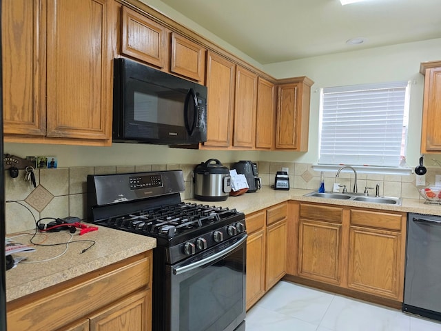 kitchen featuring sink, black appliances, and light tile patterned floors