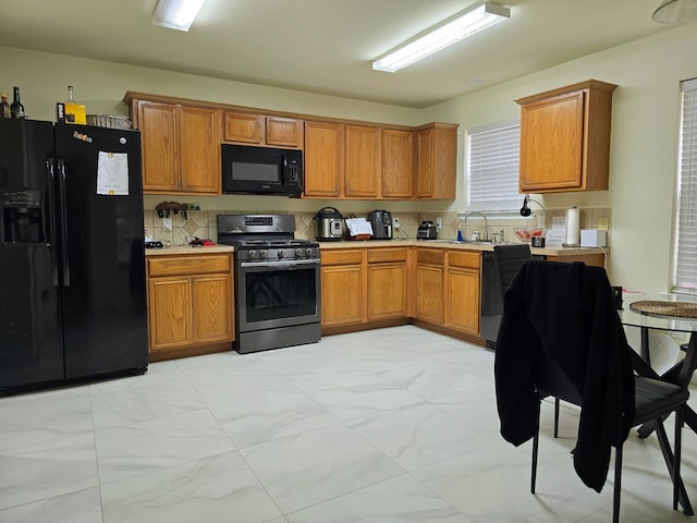 kitchen with black appliances and sink