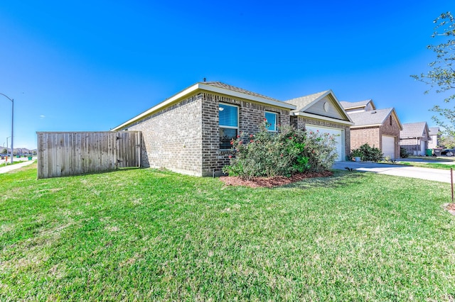 view of home's exterior with a garage and a lawn