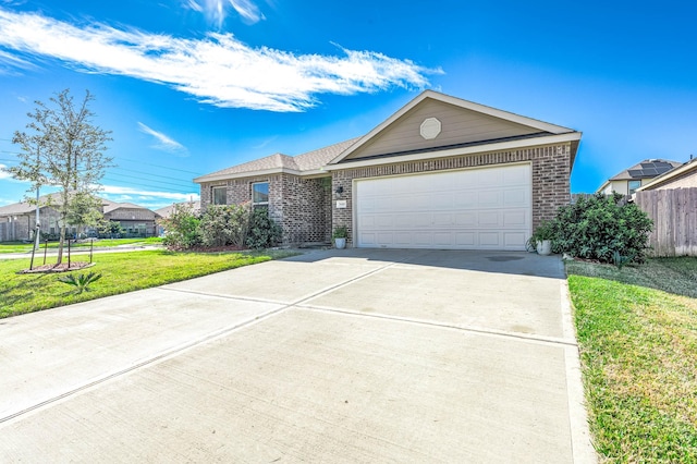 single story home featuring a front lawn and a garage