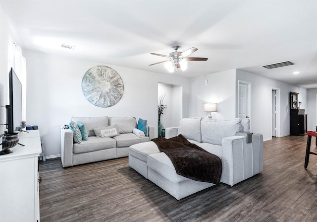 living room with ceiling fan and dark hardwood / wood-style floors