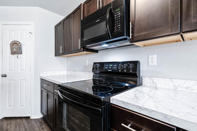 kitchen with black appliances, dark brown cabinets, and dark hardwood / wood-style floors