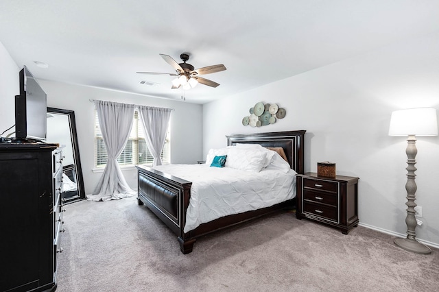 bedroom with ceiling fan and light colored carpet