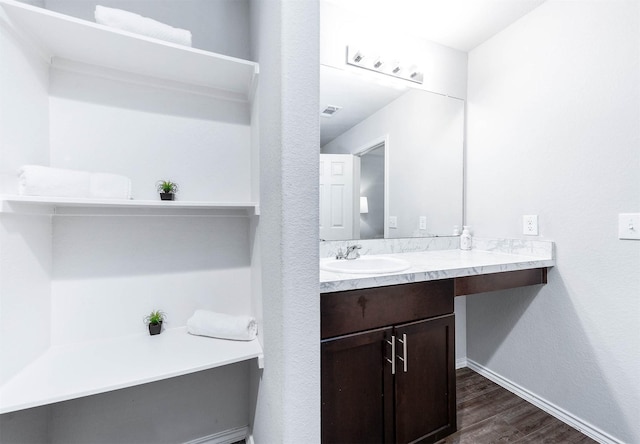 bathroom featuring wood-type flooring and vanity