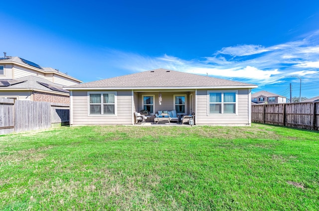 back of property with a lawn, an outdoor hangout area, and a patio