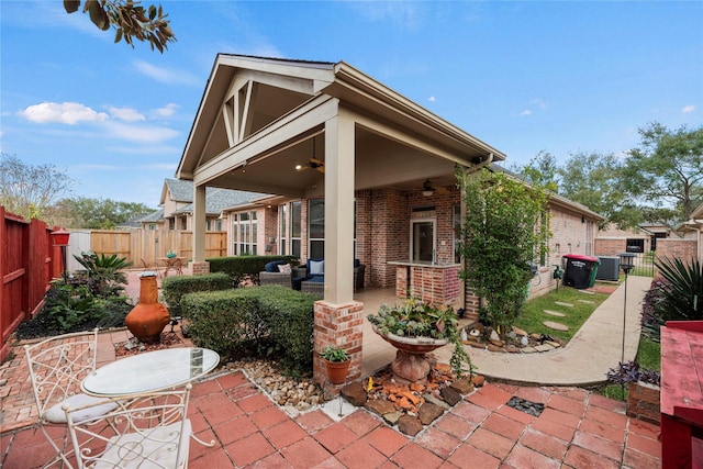 back of property with ceiling fan, a patio, and central AC unit