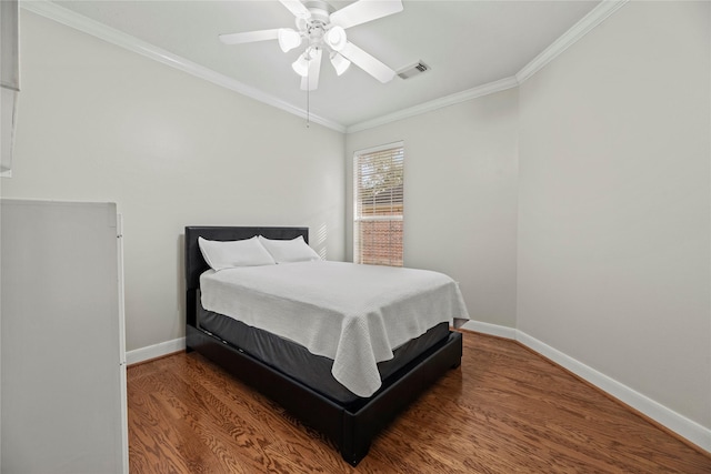 bedroom featuring ceiling fan, crown molding, and wood-type flooring