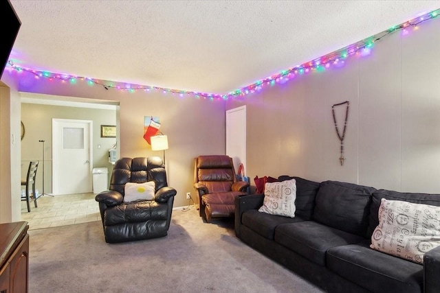 living room with a textured ceiling and light carpet