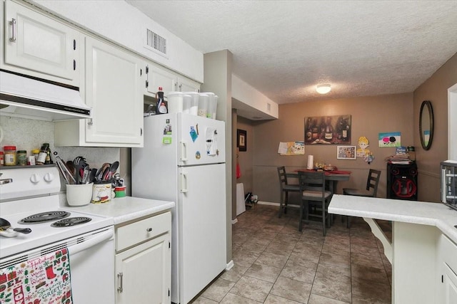 kitchen with a textured ceiling, white cabinetry, tasteful backsplash, and white appliances