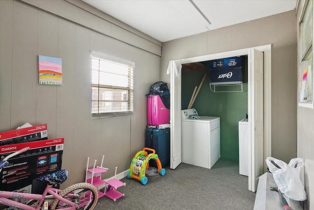 interior space featuring washer and dryer and carpet flooring