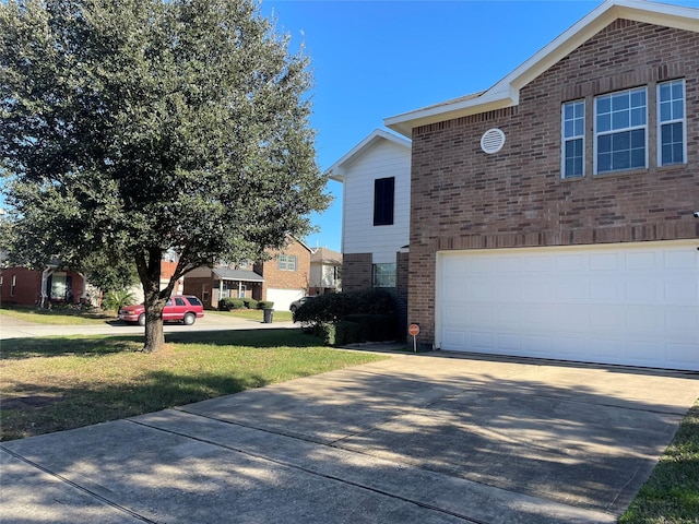 view of home's exterior featuring a lawn and a garage