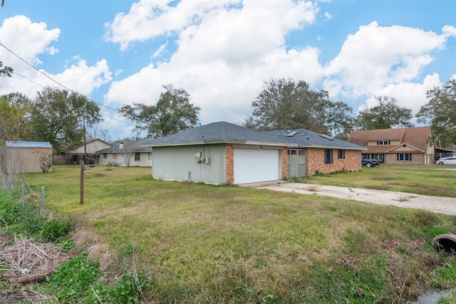 exterior space with a front lawn and a garage