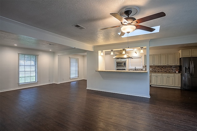 unfurnished living room featuring a textured ceiling, ceiling fan, dark hardwood / wood-style flooring, and crown molding