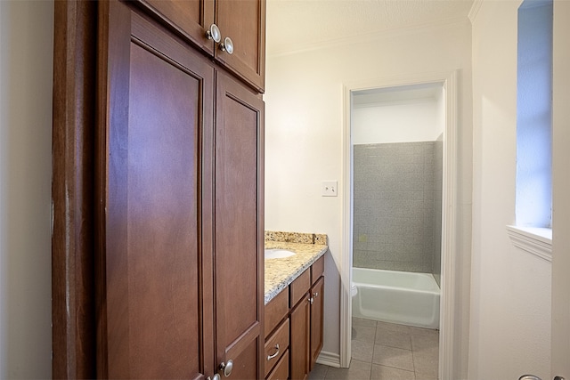 bathroom with vanity, crown molding, and tile patterned flooring