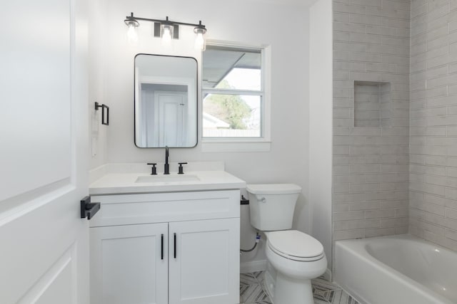 full bathroom with vanity, toilet, and tiled shower / bath combo